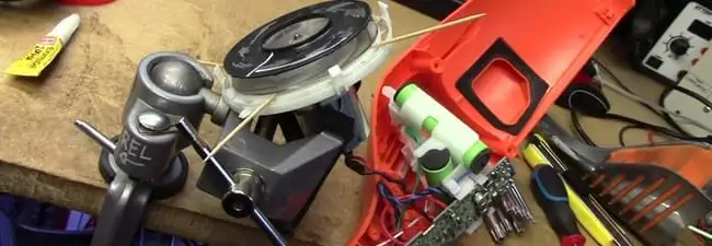 Vacuum cleaner repair parts and tools on a workbench in Las Vegas, NV