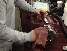 Vacuum repair technician cleaning and servicing a vacuum motor in Las Vegas, NV